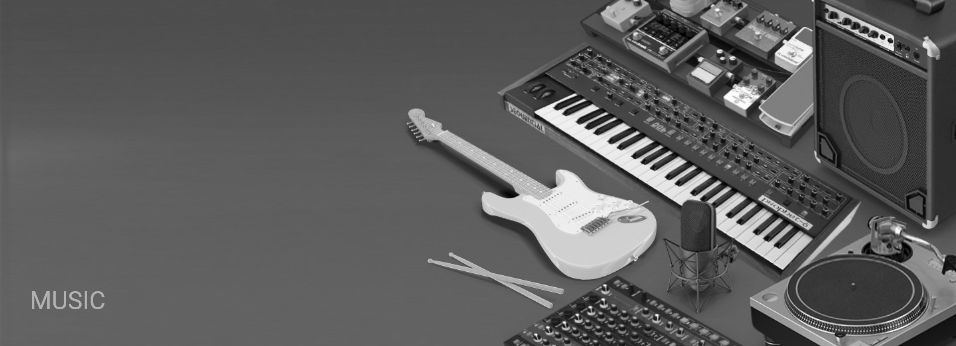 Various musical instruments and audio equipment arranged on a gray surface